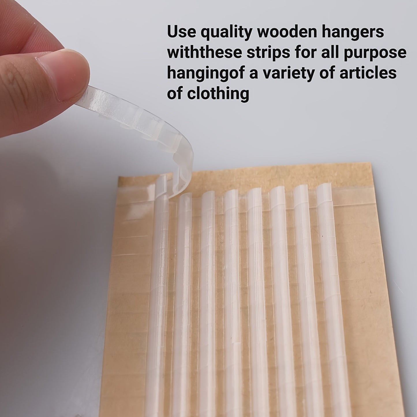 150 pieces of clear non-slip rubber grips for hangers with adhesive backing, suitable for use on both wooden and plastic hangers. Each grip measures 7.11cm x 0.58cm and features fins for added grip.