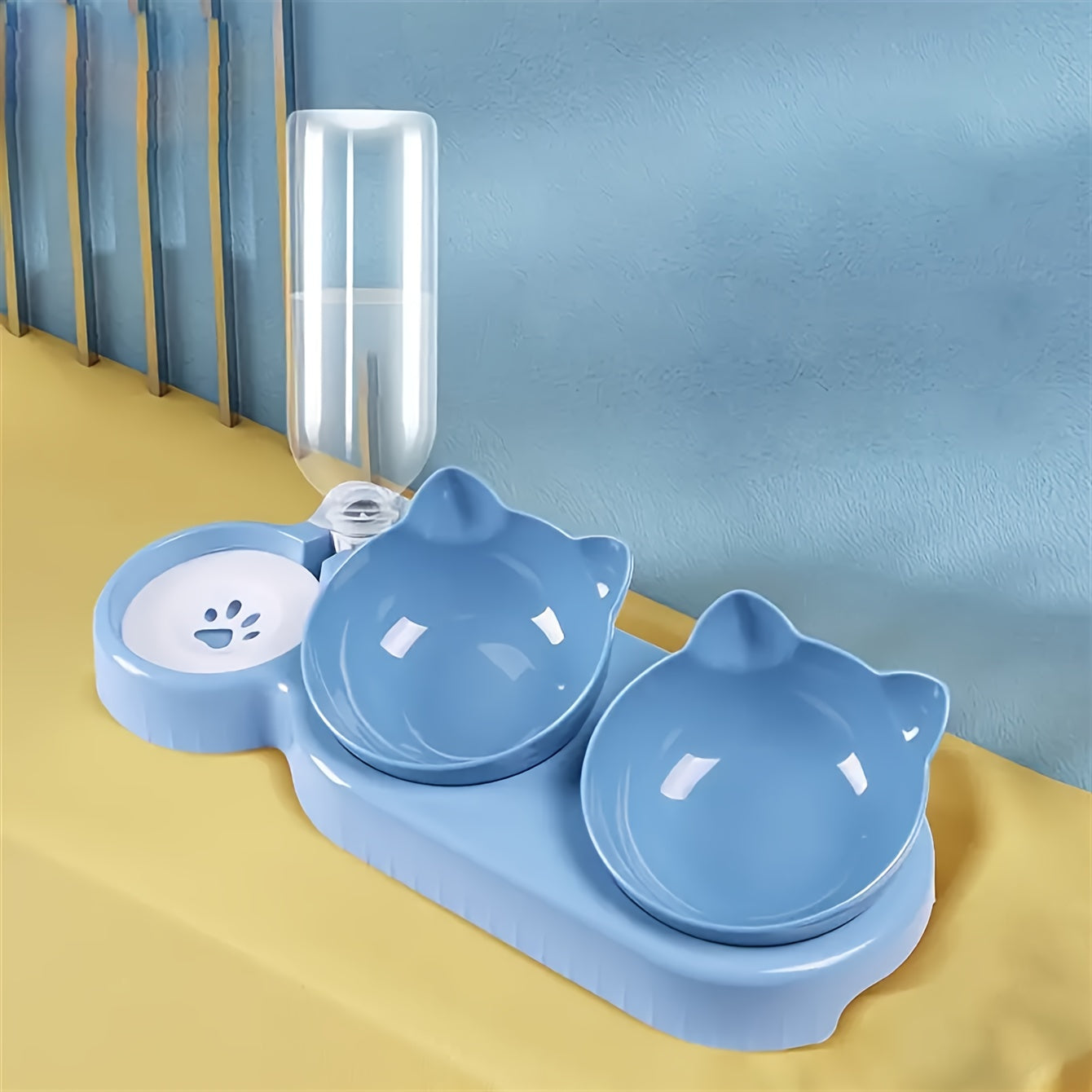 Tilted double pet bowl set with automatic water feeder and gravity water bottle for neck protection.