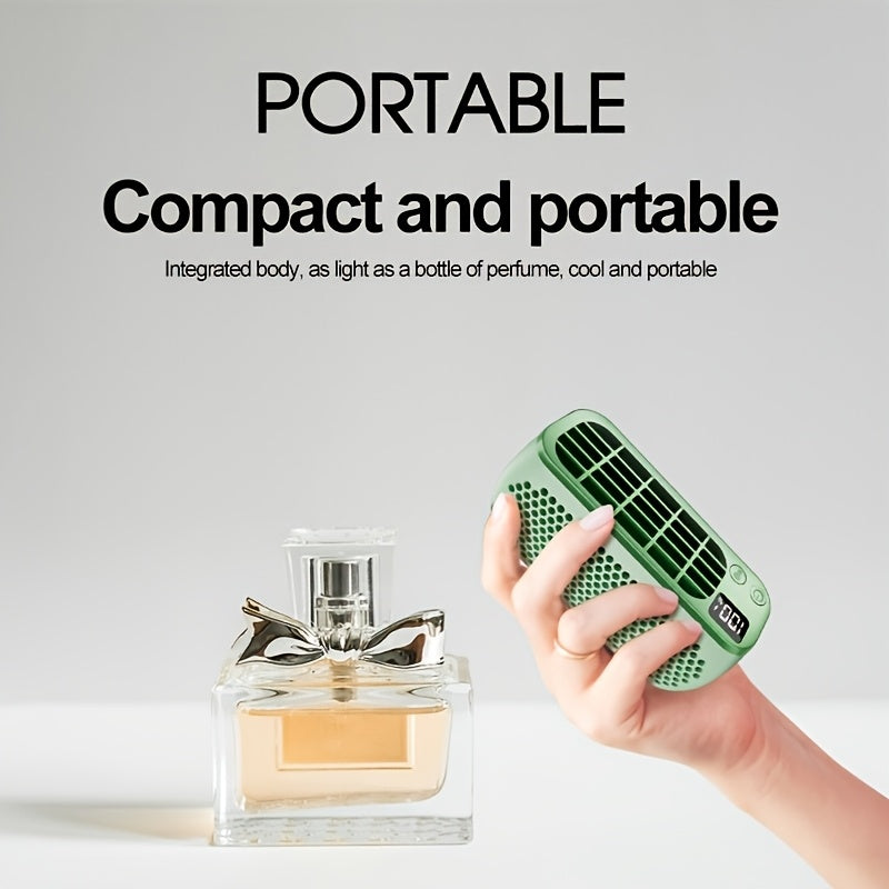 The perfect companion for summer travels, this Portable Mini USB Fan features adjustable wind speeds, a 1200mAh battery, a clear screen, and touch control. It is suitable for both indoor and outdoor use, making it a must-have for staying cool on the go.