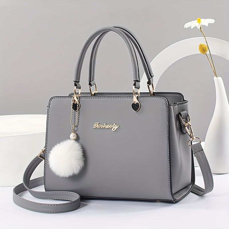 Solid color handbag with multi-layer crossbody design, satchel purse for women with pompom ball charms.