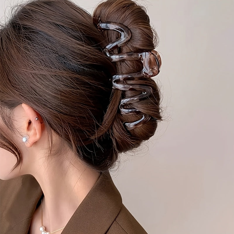 3 Wavy Leopard Print Hair Claw Clips in Clear, Red, and Brown. Stylish plastic accessories for everyday and gifting.