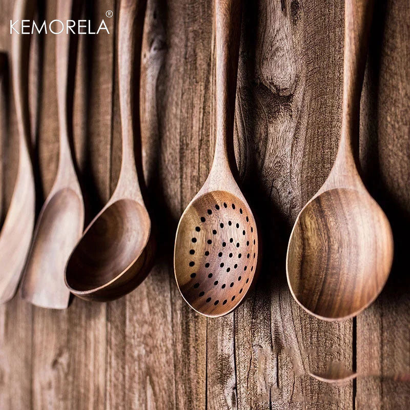 Set of 4/7 pieces of kitchen tools made from natural teak wood from Thailand, including spoons, ladles, turners, colanders, skimmers, and scoops, suitable for cooking and serving in the kitchen.