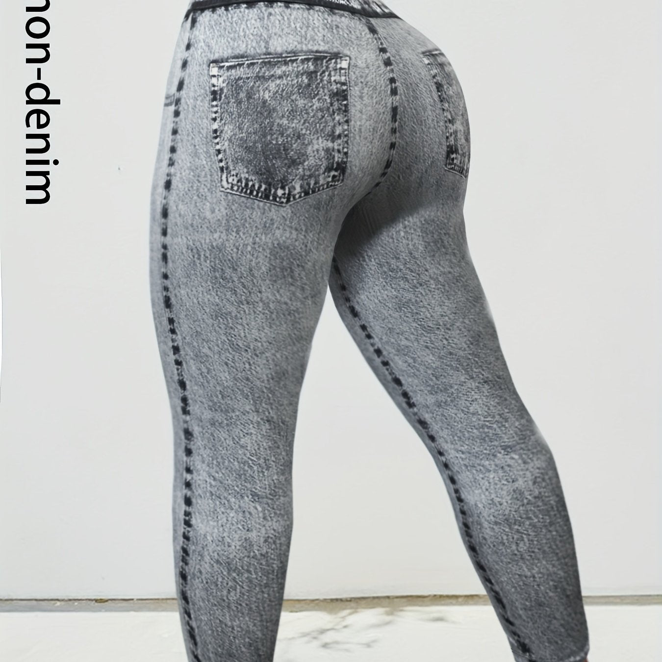 Plus size women's skinny faux denim pants made from 95% polyester and 5% elastane. Casual all-season knit fabric with medium stretch and all-over faux denim print. 230g/m².