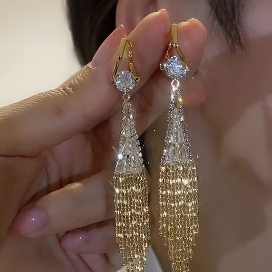 Elegant tassel earrings with sparkling zirconia, perfect for everyday wear or special occasions. Add a touch of glamour to your casual outfits or date night look.