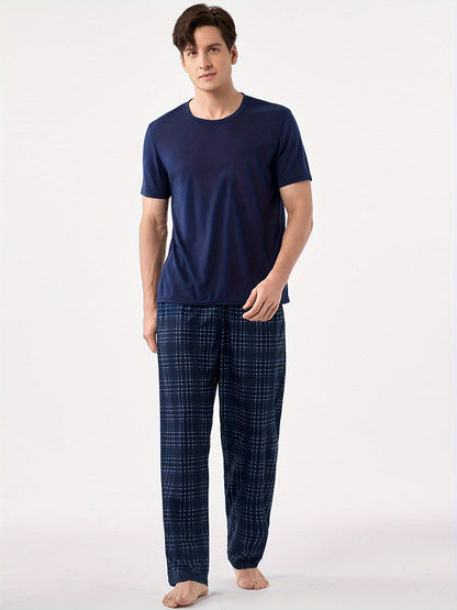 Men's blue pajama set with classic round neck, short sleeves, and plaid trousers for cozy loungewear.