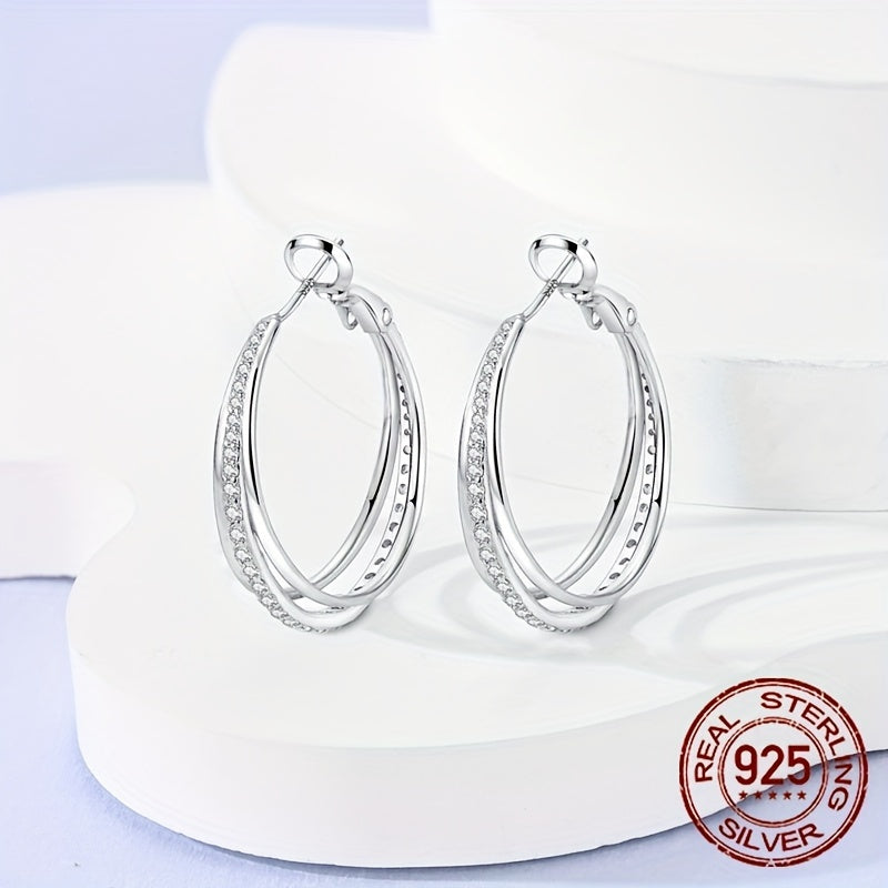 A pair of beautiful Sterling Silver 925 earrings with three hoops, adorned with luxurious zirconia for an elegant and delicate look, perfect for women.