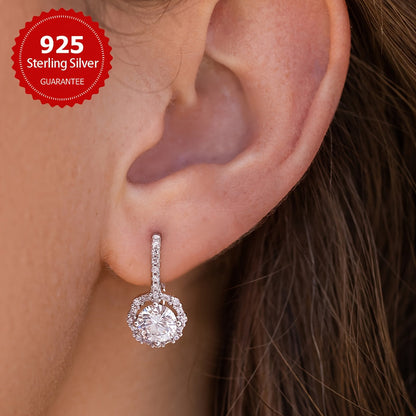 These elegant earrings feature two dazzling 1CT Moissanite round stones set in 925 sterling silver, with a total weight of approximately 2.91 grams. Perfect for weddings or as a luxurious Valentine's Day gift for your beloved.