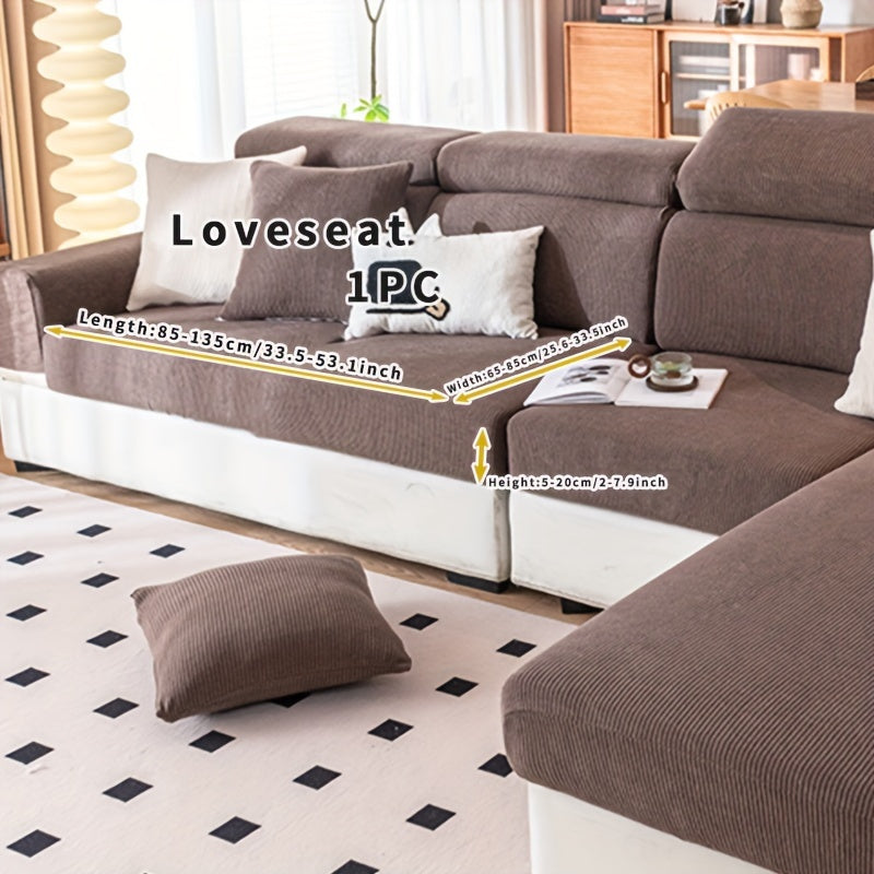 Stretchable polyester sofa cover with elastic band, pet-friendly polar fleece material, machine washable, fits armchair to sectional sofas, home decor slipcover for furniture.