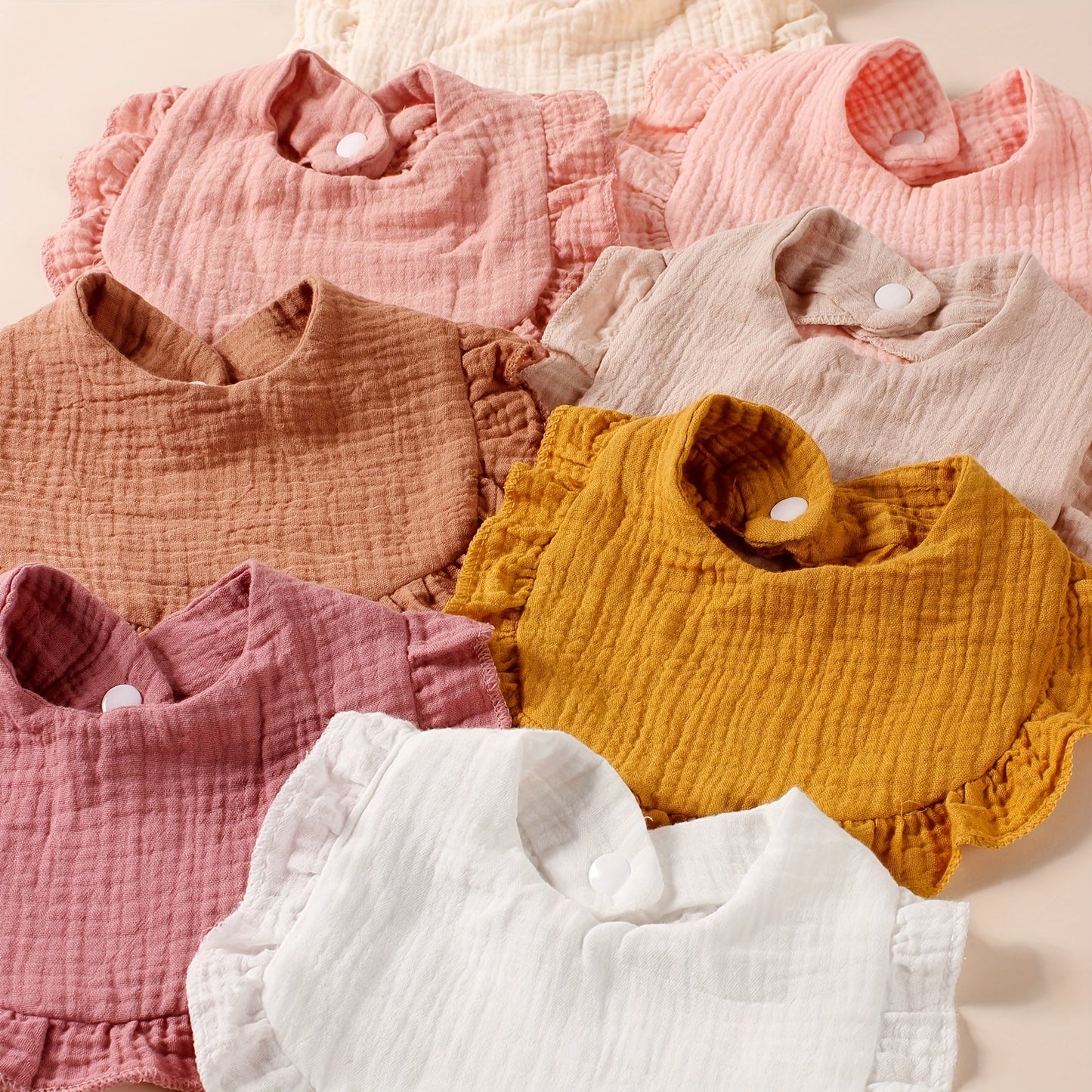 Eight pieces of 2-layer soft bibs with wrinkle-resistant and breathable fabric, ideal for feeding and keeping baby clean. These adorable cotton ruffle bibs are perfect for catching saliva and spills.