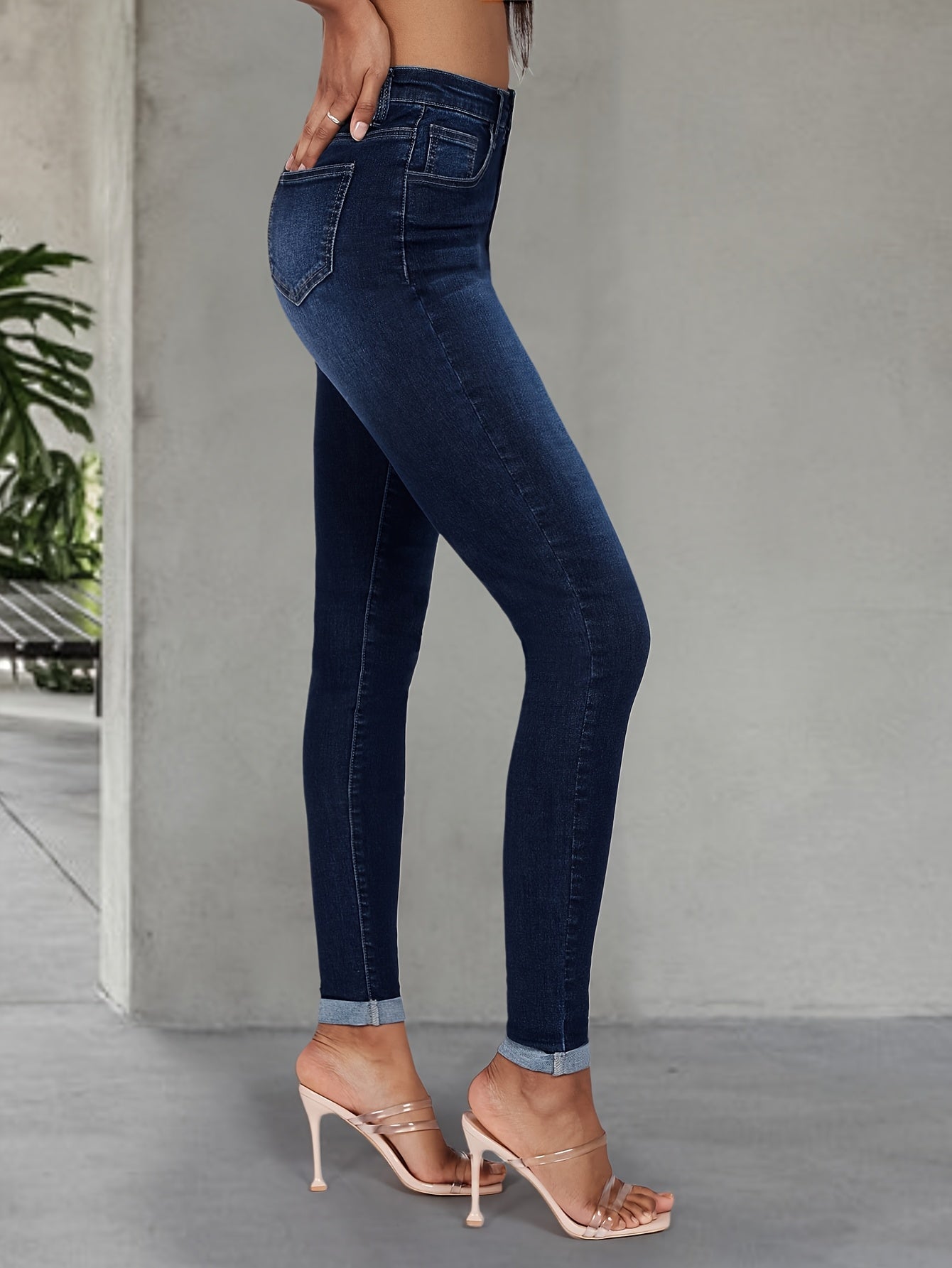 Elegant high stretch skinny jeans for women, long length with button detail, perfect for all seasons.