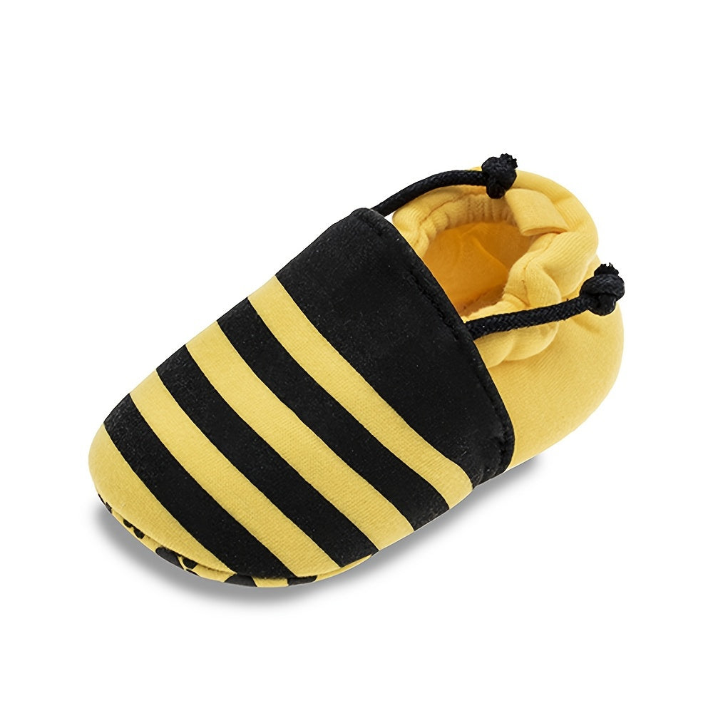 Baby slip-on walking shoes with cute bee cartoon design, fabric upper, cloth insole, and fabric sole suitable for all seasons.