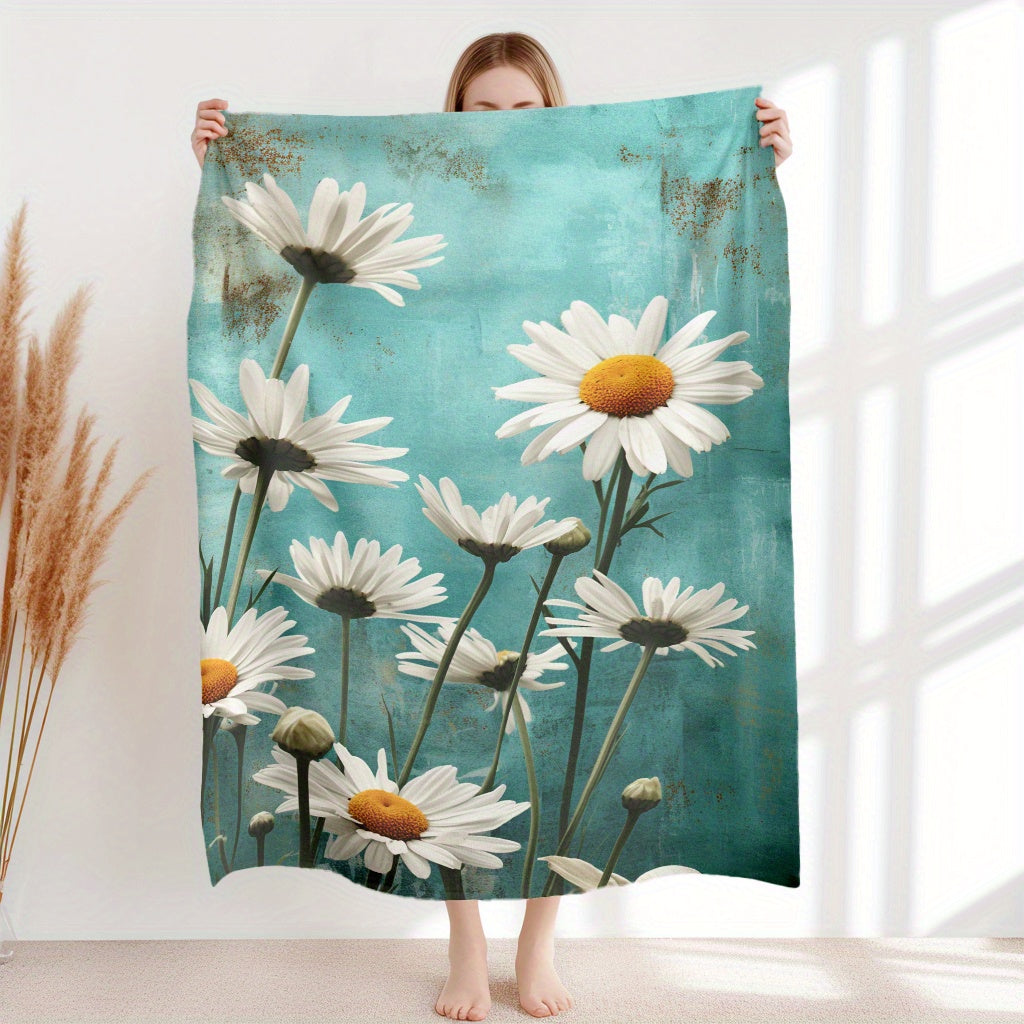 Soft and cozy Flannel Fleece Throw Blanket featuring a beautiful White Daisy Floral Pattern. This lightweight, all-season blanket is made of knitted polyester, making it perfect for use at home or while traveling. It is washable and can be used for