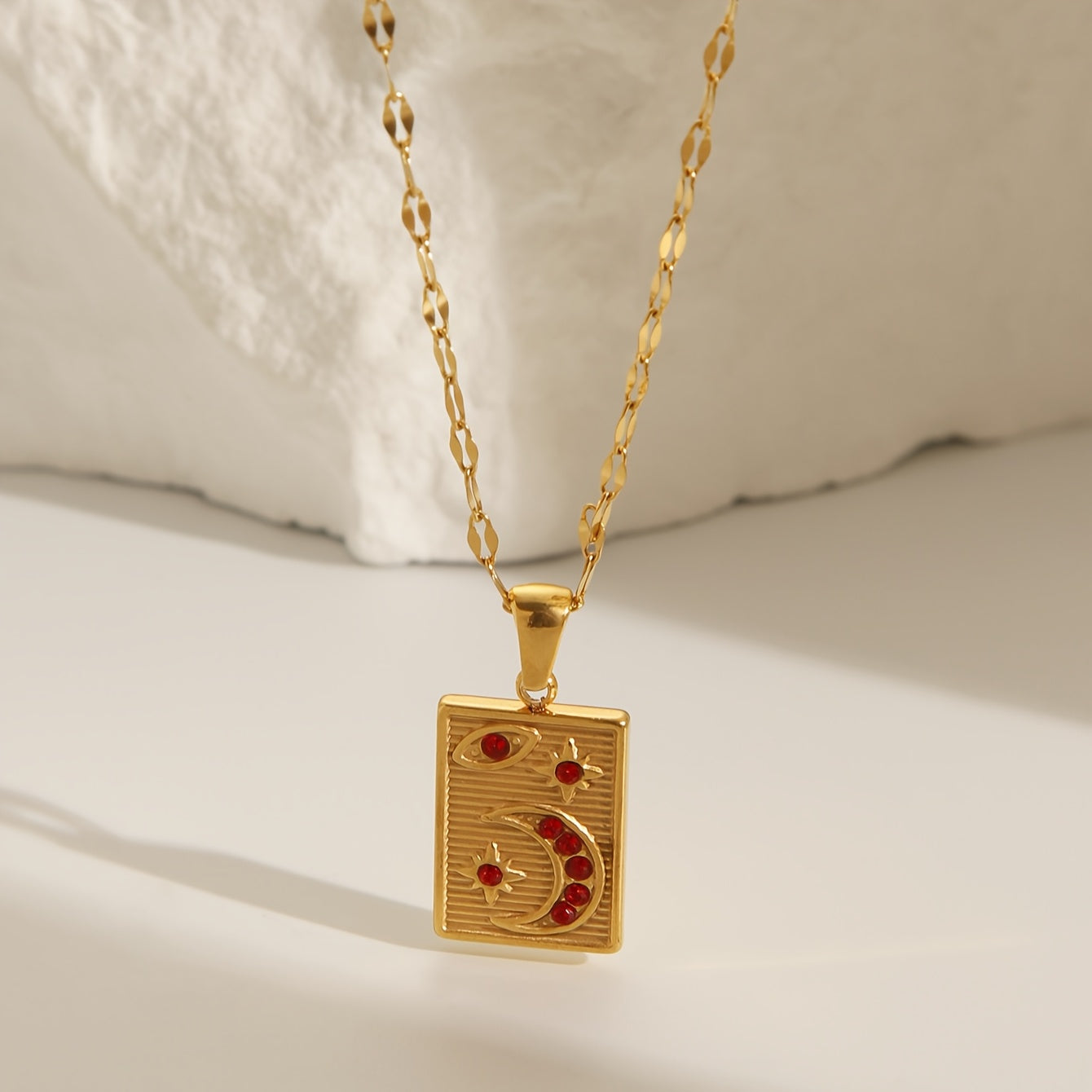 18K Golden Plated Stainless Steel Pendant Necklace featuring a Minimalistic Geometric Rectangle & Crescent Moon Design adorned with Red Synthetic Zirconia Stones, a Stylish and Versatile Piece of Fashion Jewelry perfect for Women to Wear on Both Daily