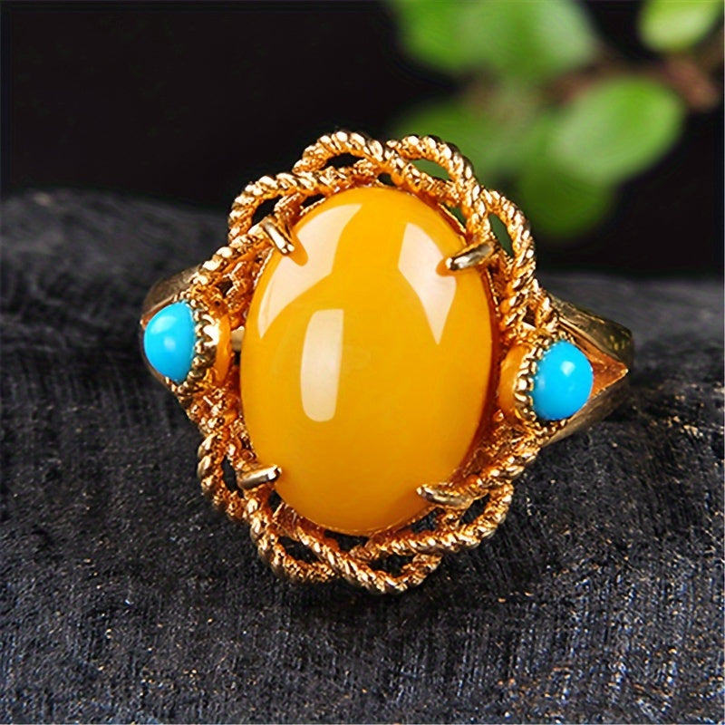 Vintage vacation style Claddagh ring featuring synthetic amber and turquoise stones, crafted with 18K golden plated 925 silver. The ring has an adjustable opening and is perfect for both daily wear and special occasions. This handcrafted personalized