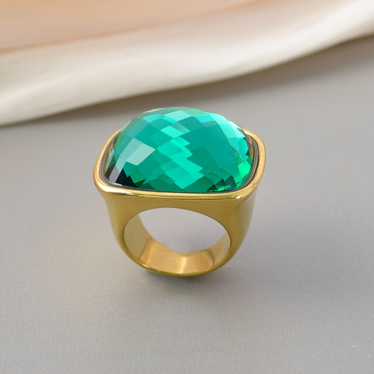 Elevate Your Look with our 1PC Hip Hop Luxury Style Square Gemstone Ring! This elegant statement ring features a large stone and is perfect for daily wear or special occasions. Made with 18K plated zirconia inlay and stainless steel band, this Mardi Gras