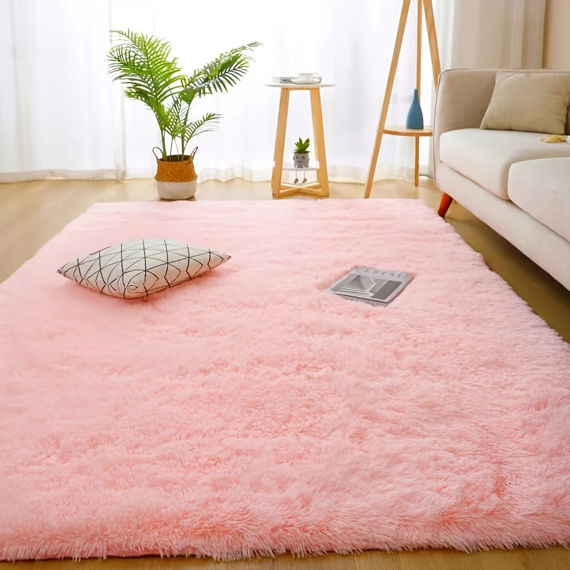 Luxurious soft plush faux fur area rug with anti-slip knitted polyester backing. This machine-made thick, warm, and fluffy mat is perfect for bedroom and living room use. It is hand washable and stain-resistant, making it easy to care for and