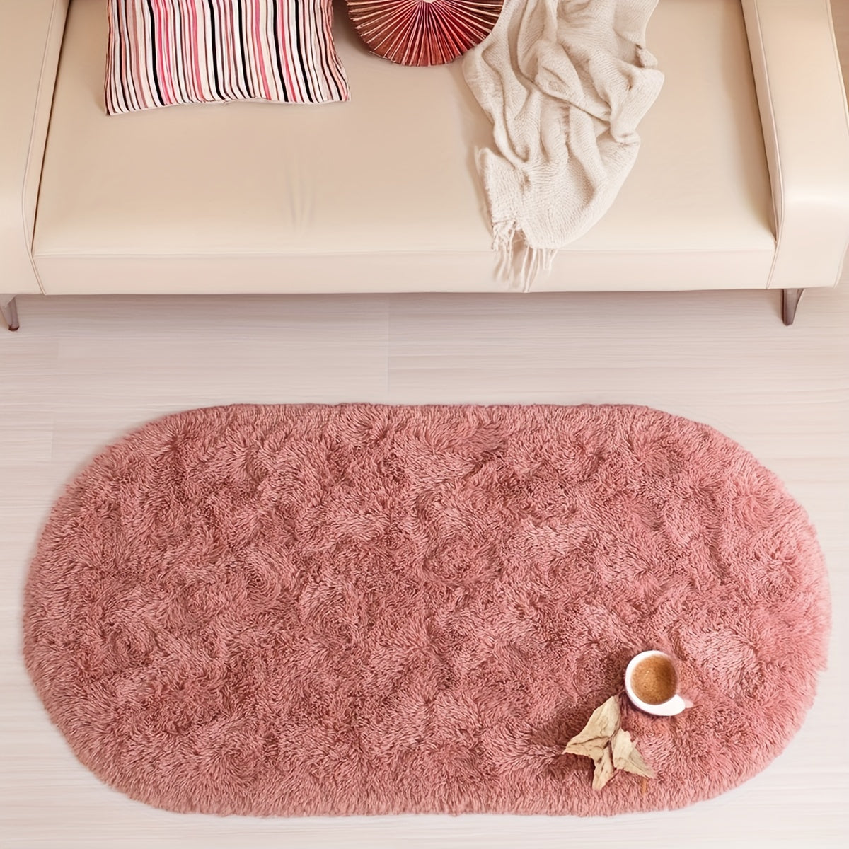 Soft and fluffy oval shaggy area rug, perfect for bedroom or living room. Made with skin-friendly thickened sponge and tufted polyester material. Durable and easy to maintain. Adds decorative touch to indoor spaces such as sofa, bedside, playroom, or