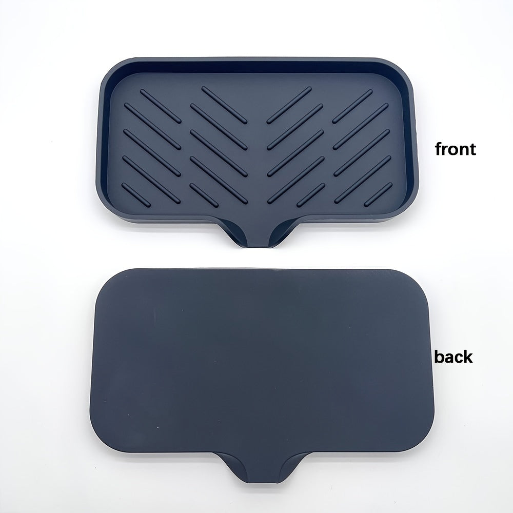 Silicone soap dish with self-draining tray for kitchen or bathroom sink, also functions as a non-slip sponge holder and soap saver pad.