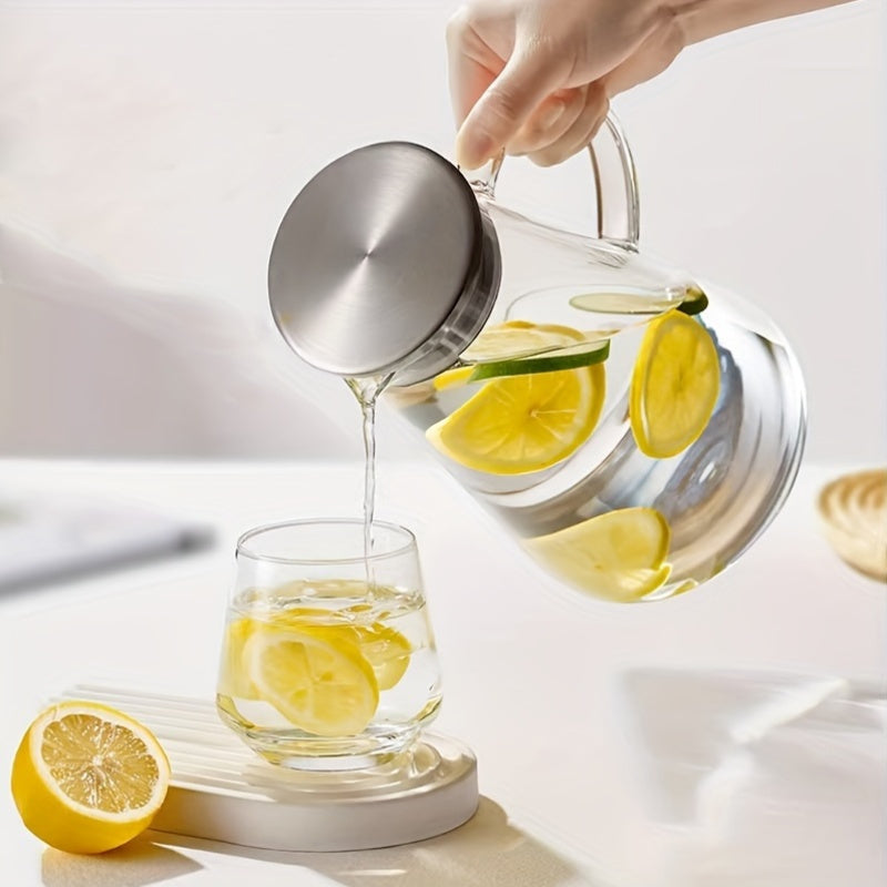 Heat resistant glass pitcher with lid, perfect for hot/cold drinks. Featuring a 1.8L clear beverage carafe with handle for easy serving. Ideal for home, restaurant, or office use. Easy to clean and makes a great gift for Christmas or New Year. A