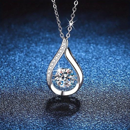 Chic and sophisticated silver-plated copper necklace featuring a stunning teardrop pendant embellished with sparkling synthetic cubic zirconia. This versatile piece is perfect for everyday wear, special occasions, and makes a luxurious gift for Mardi