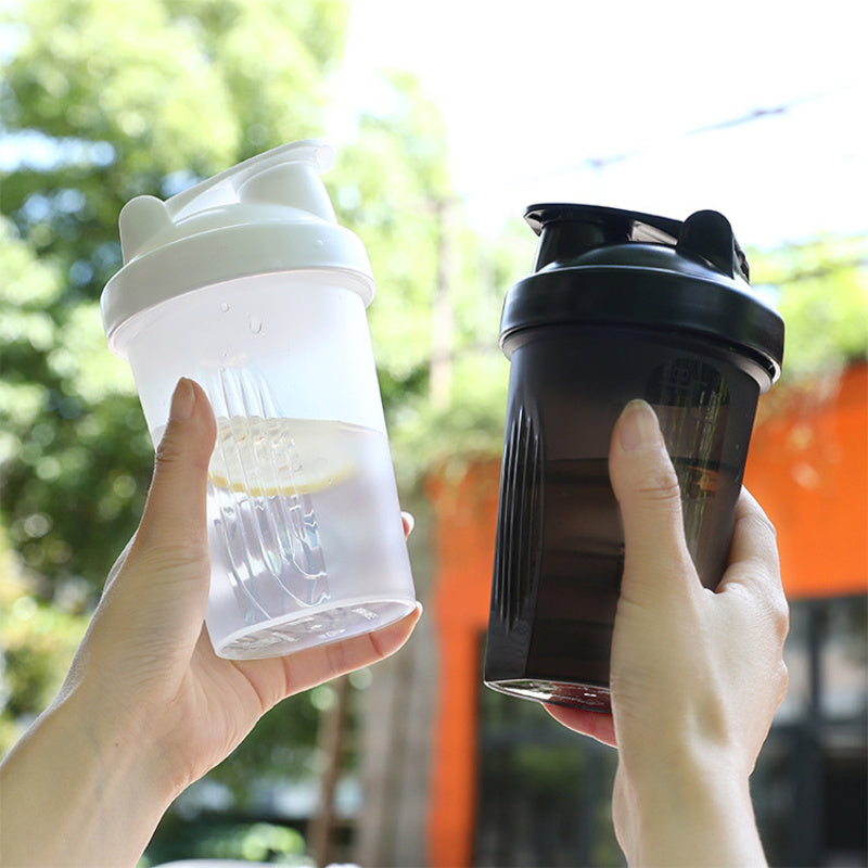 BPA-Free Protein Shaker Bottle with Leakproof Lid and Stainless Steel Mixing Ball - Hand wash only, ideal for gym and travel.