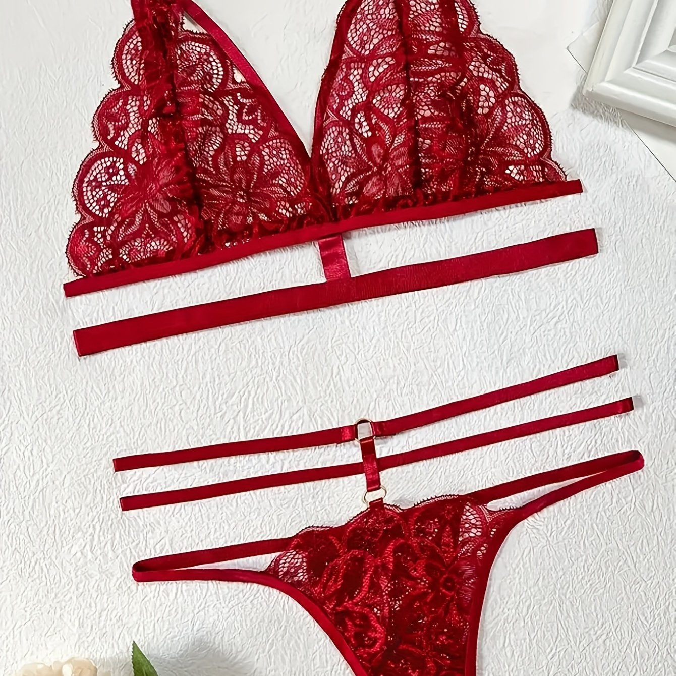 Sexy lace patchwork belt lingerie set includes bra and thong for women.