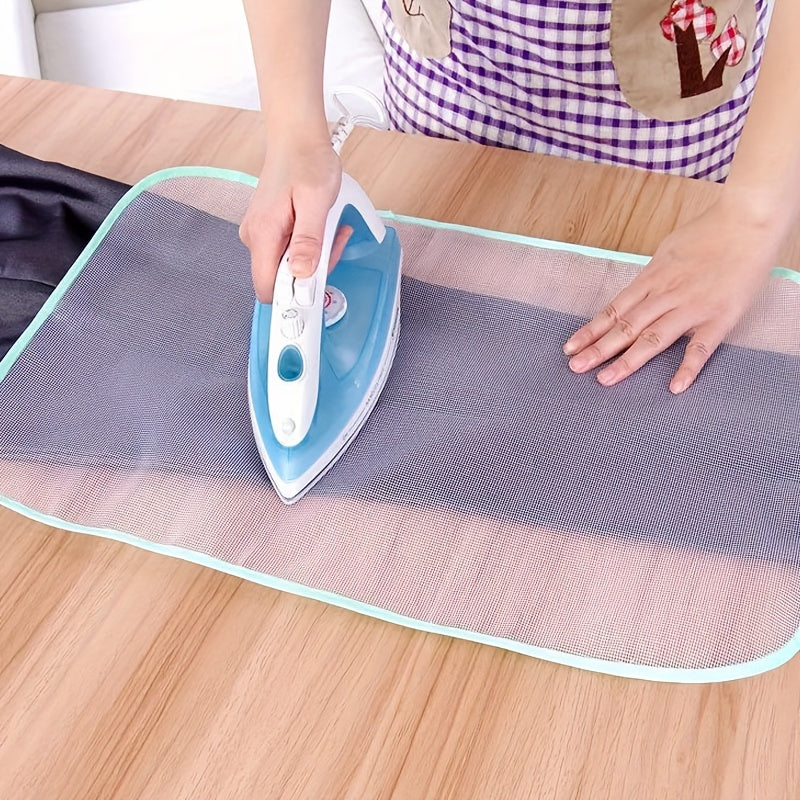 Durable ironing mesh pad for smooth, high-temperature ironing with zipper and button protection, machine washable.