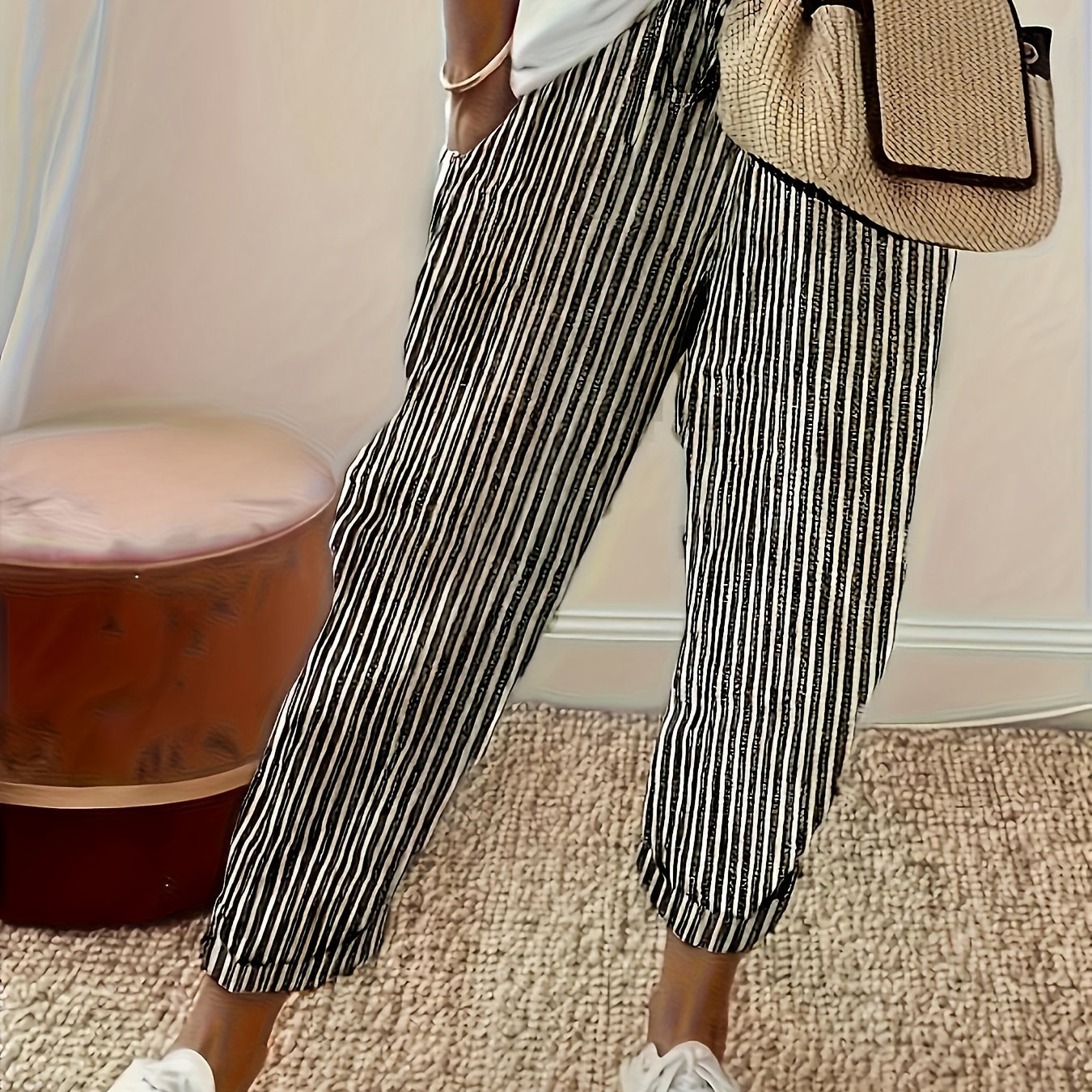 High-waisted, striped wide-leg pants for women made of lightweight polyester. Machine washable with side stripe detail for all-season comfort.