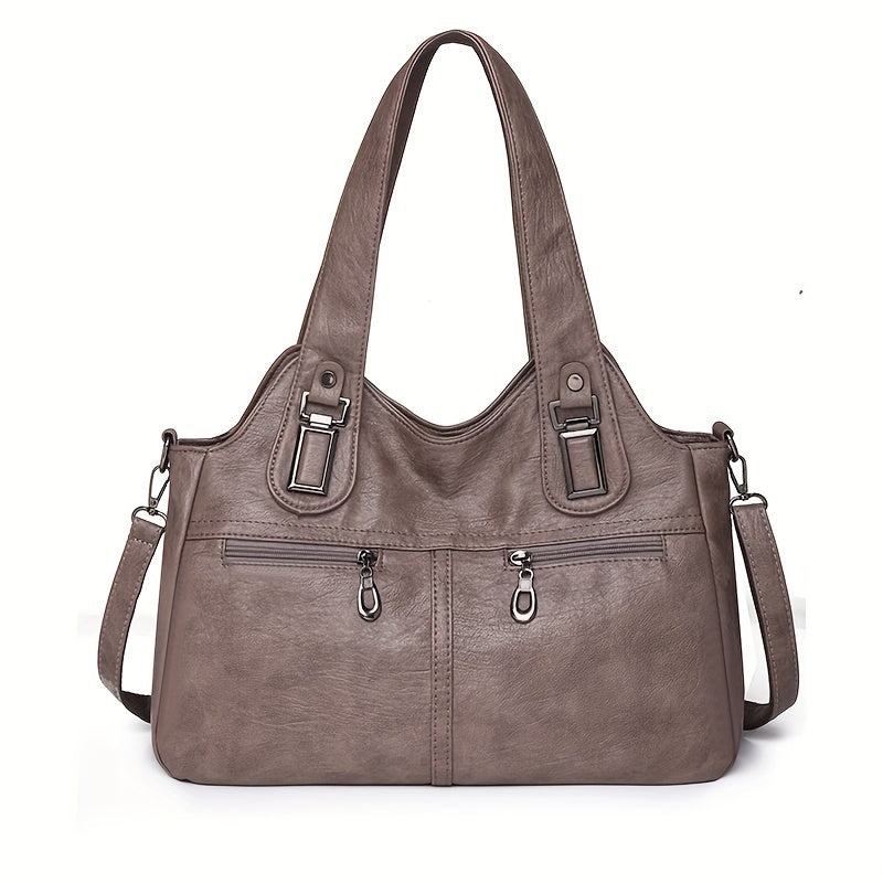 Stylish women's crossbody bag with multiple pockets, detachable strap, chic design, zip closure, and polyester lining.