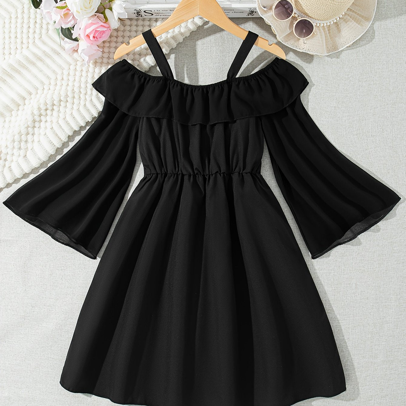 Black chiffon dress with off-shoulder ruffle detail, perfect for casual summer style.