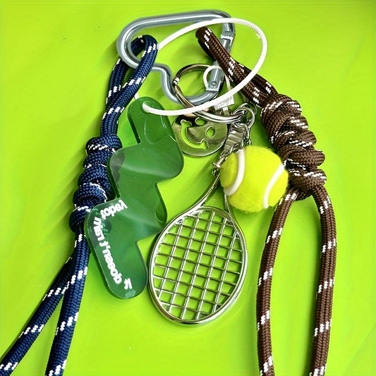 Metal keychain set featuring a tennis racket and ball design with rope accents, perfect for decorating bags with a sports theme. This multi-piece key ring accessory is ideal for attaching car keys and makes for a great Valentine's Day gift.