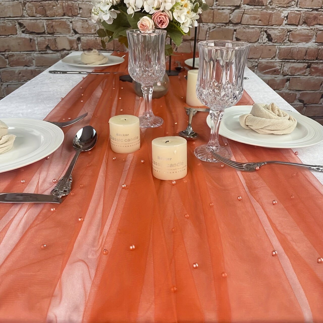 Elegant pearl bead tulle table runner, perfect for weddings and parties. Can also be used as a chair sash or backdrop drape. Made from 100% polyester fabric with delicate bead detailing.