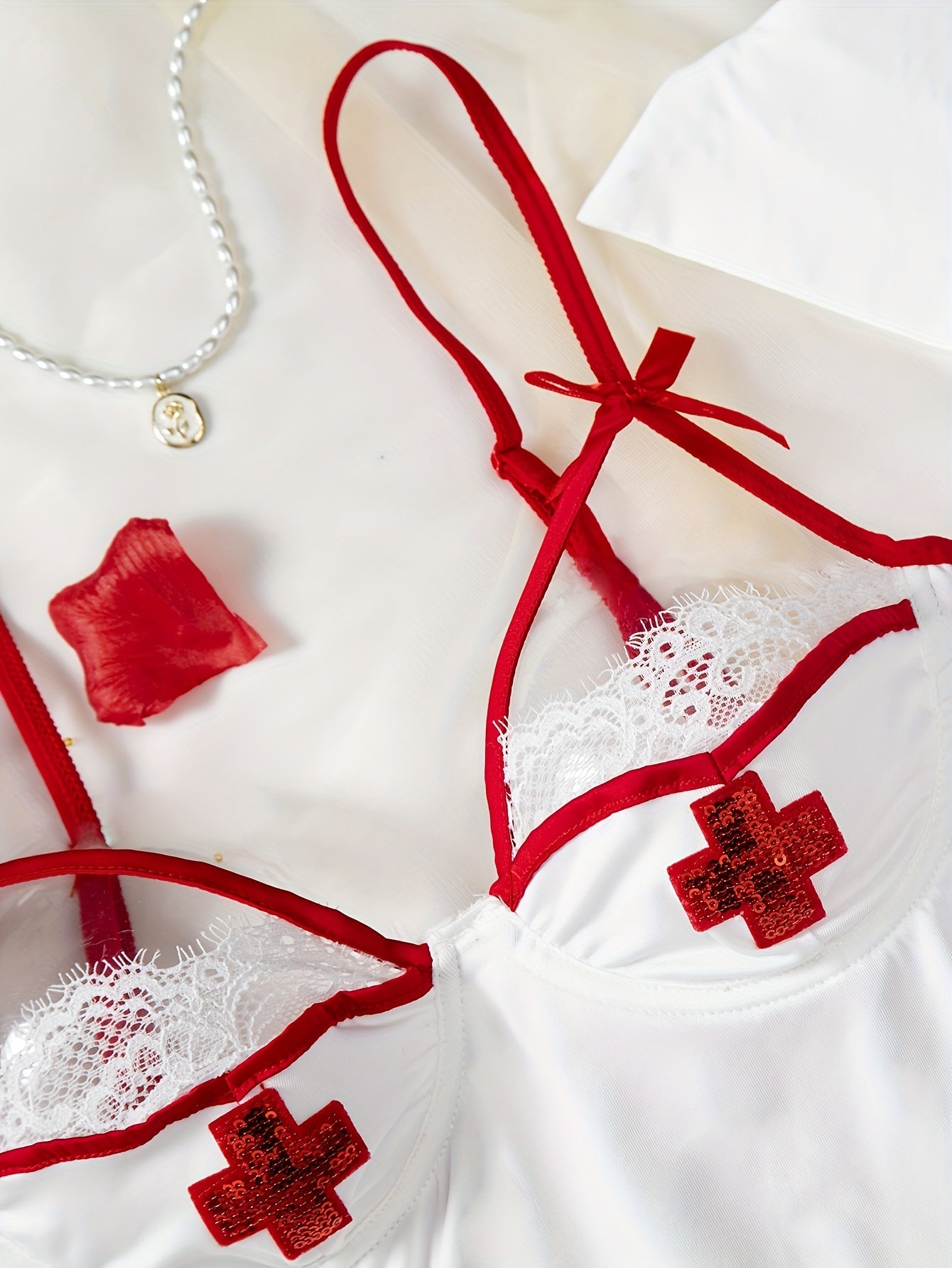 Sexy nurse cosplay costume with bow spaghetti strap design.