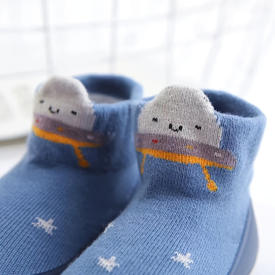 Cute lion cartoon slip-on sock shoes for baby boys in light blue with yellow accents. Soft, breathable, and non-slip rubber sole, perfect for first walkers in spring and fall.