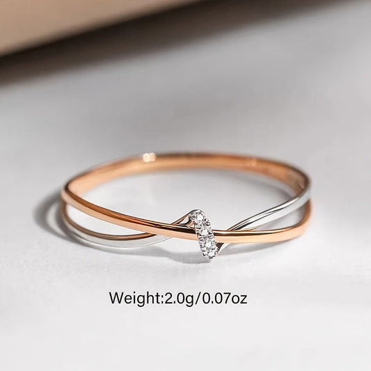 Rose Gold Double Knot Ring - This exquisite ring features elegant rose gold intertwined in a double knot design, crafted with 925 sterling silver and embellished with sparkling cubic zirconia stones. Perfect for celebrating your anniversary, this 2.0g