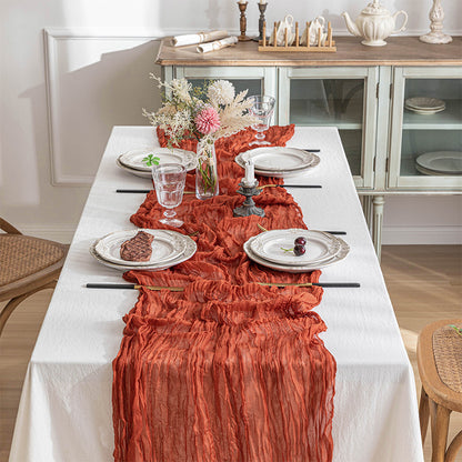 Boho cheesecloth table runner for various occasions and home decor.