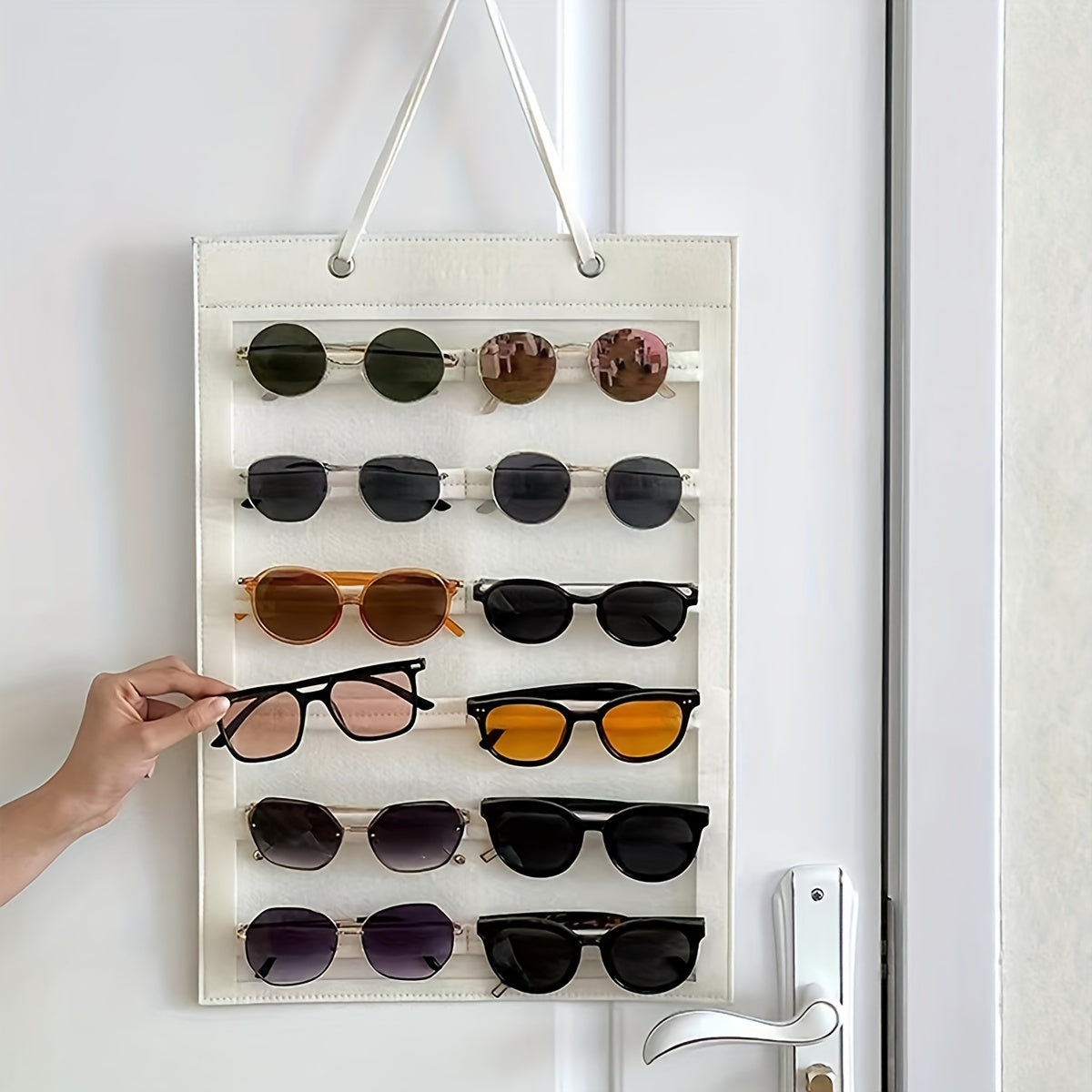 Organize your sunglasses with this hanging wall organizer featuring 12 slots made of felt. Keep your glasses dust-proof and easily accessible with this storage display pocket wall stand holder.