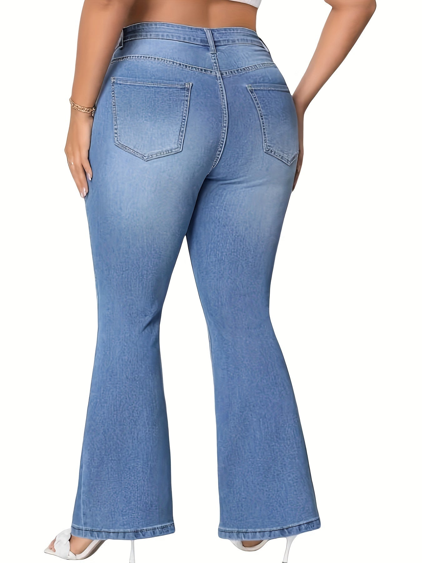 Women's plus size blue flare jeans made of stretch denim with a classic button closure, perfect for casual wear.