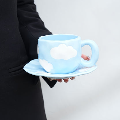 Cloud-shaped ceramic coffee mug with saucer - reusable, handwash only, ideal for breakfast & office use - great gift idea.