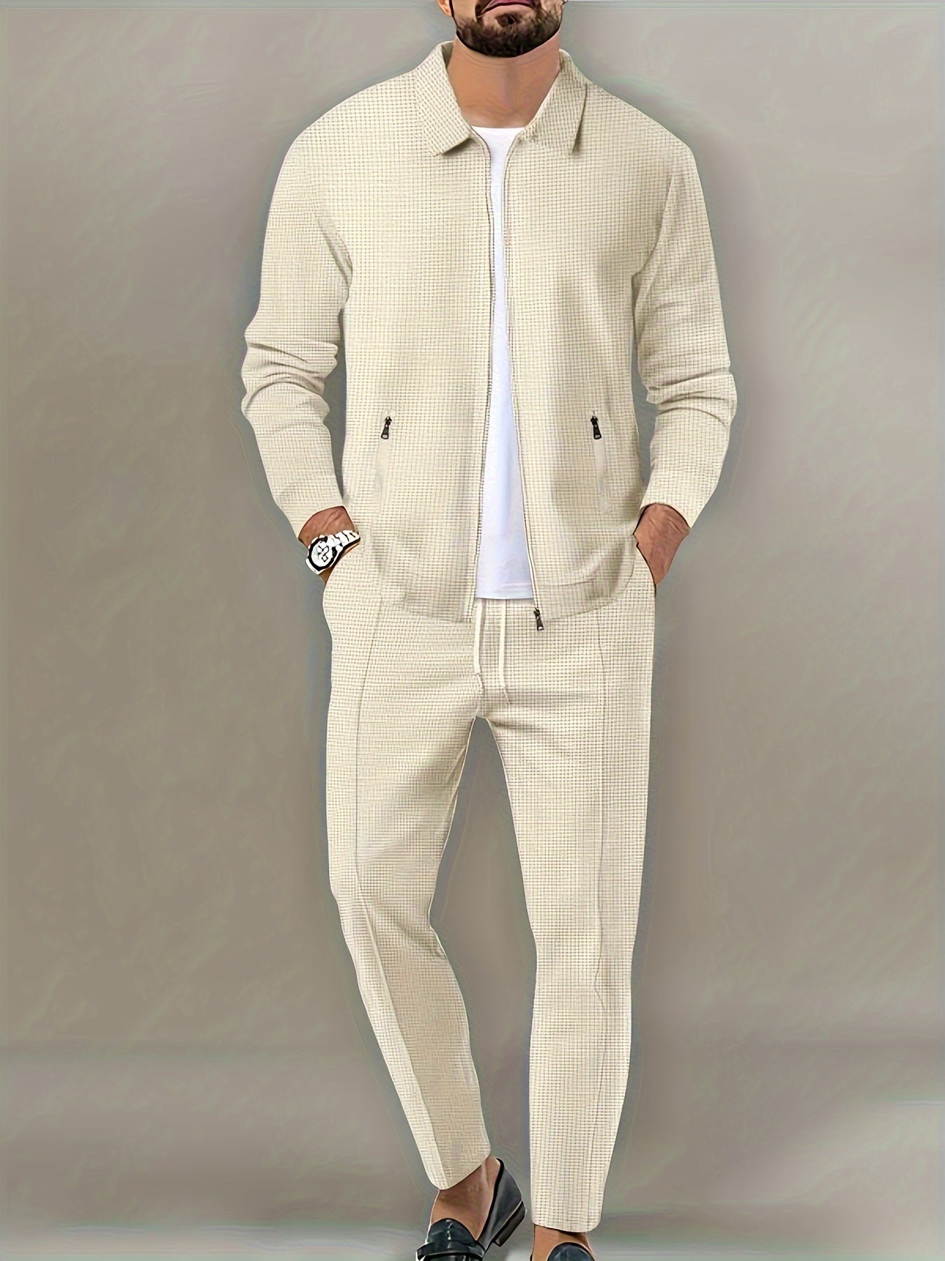 Men's beige waffle knit tracksuit set. Includes full-zip jacket and jogging pants. Made from polyester/spandex blend, machine washable. Perfect for gym and outdoor activities.