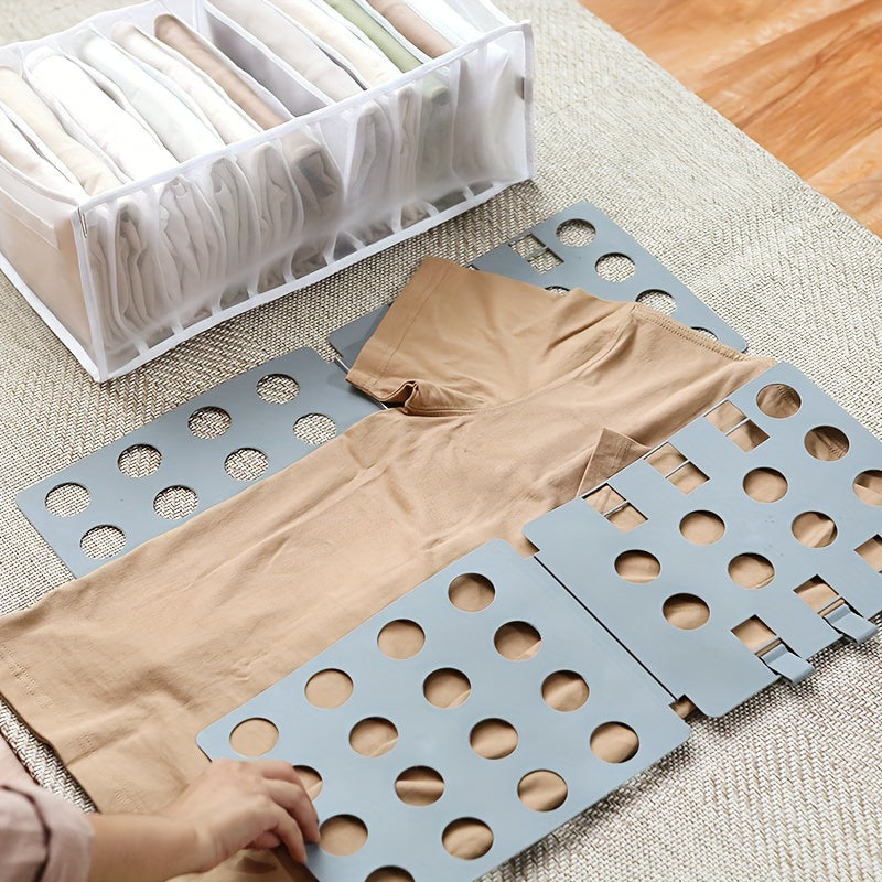 Get organized with our durable plastic Space-Saving Clothes Folding Board. This adjustable board is perfect for folding t-shirts and more, making it ideal for travel or home organization. It helps maximize closet space and can be easily stored when not