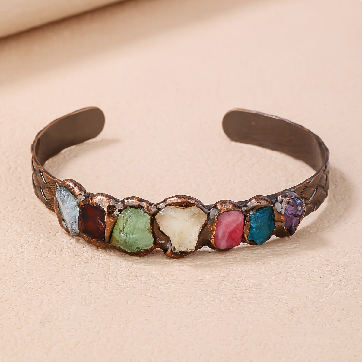 Handmade Bohemian Copper Cuff Bracelet adorned with 7 gemstones, featuring a unique burnt welded design. This beautiful piece showcases a vibrant mosaic of natural rock crystals, making it a perfect accessory for summer parties and Mardi Gras