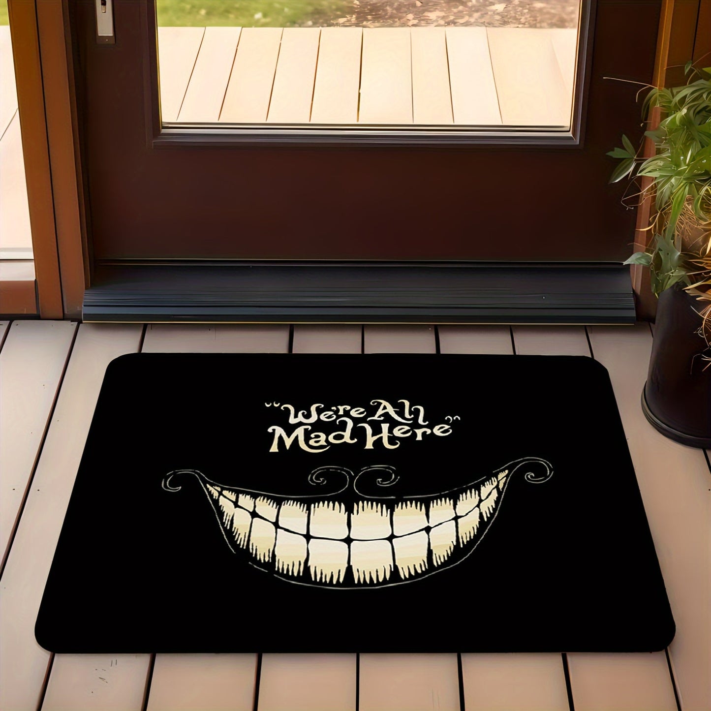 Welcome to Cheshire Smile Doormat - A soft and absorbent entrance mat made from polyester fleece, featuring a charming tooth and letter print design. This 1cm thick mat is anti-slip and perfect for your living room, bedroom, front door, or hallway. Add a