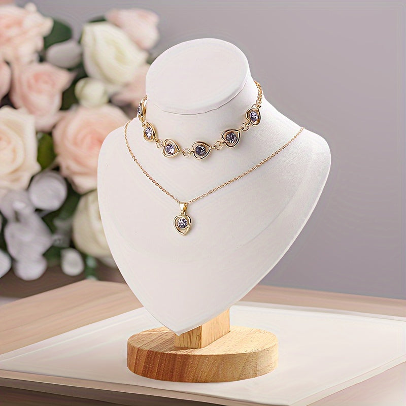 Wooden mannequin jewelry stand for displaying necklaces on dresser or window, ideal for home organization or retail showcasing.