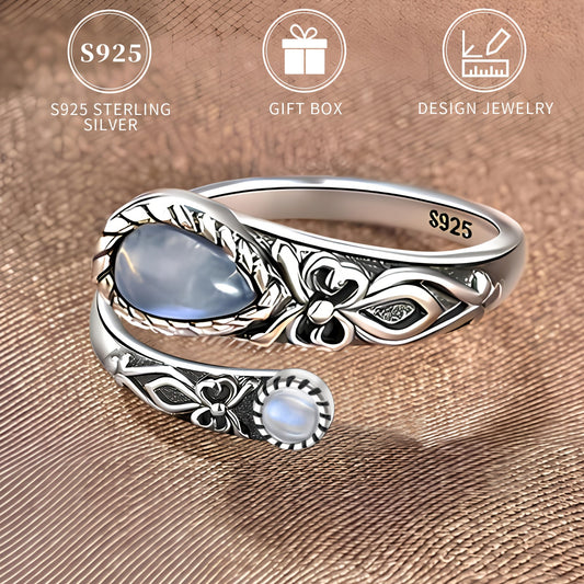 This S925 Sterling Silver Moonstone Ring features a vintage boho style, with an adjustable spoon band and synthetic stone. It also has a delicate butterfly detail, making it perfect for daily wear or as a thoughtful gift for Mother's Day. Comes with a