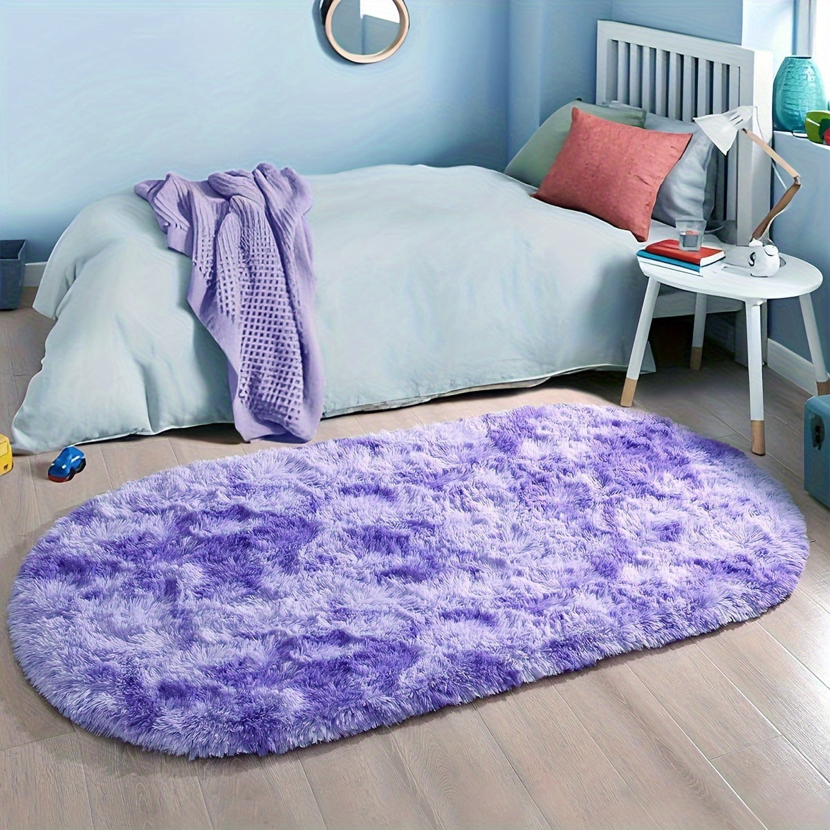 Soft and fluffy oval shaggy area rug, perfect for bedroom or living room. Made with skin-friendly thickened sponge and tufted polyester material. Durable and easy to maintain. Adds decorative touch to indoor spaces such as sofa, bedside, playroom, or