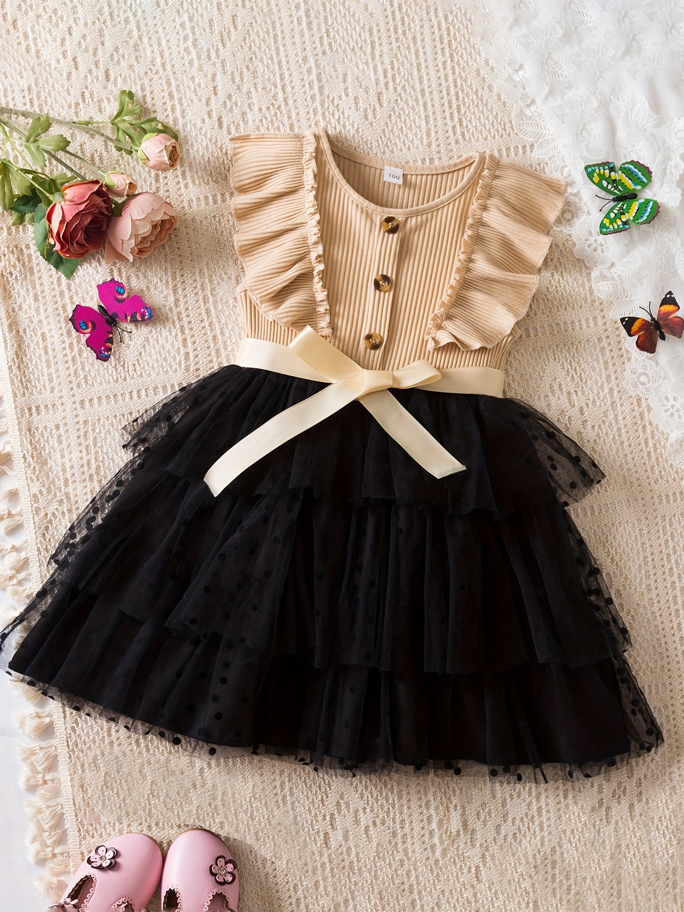 Elegant polka dot print tutu dress with button design for summer parties.