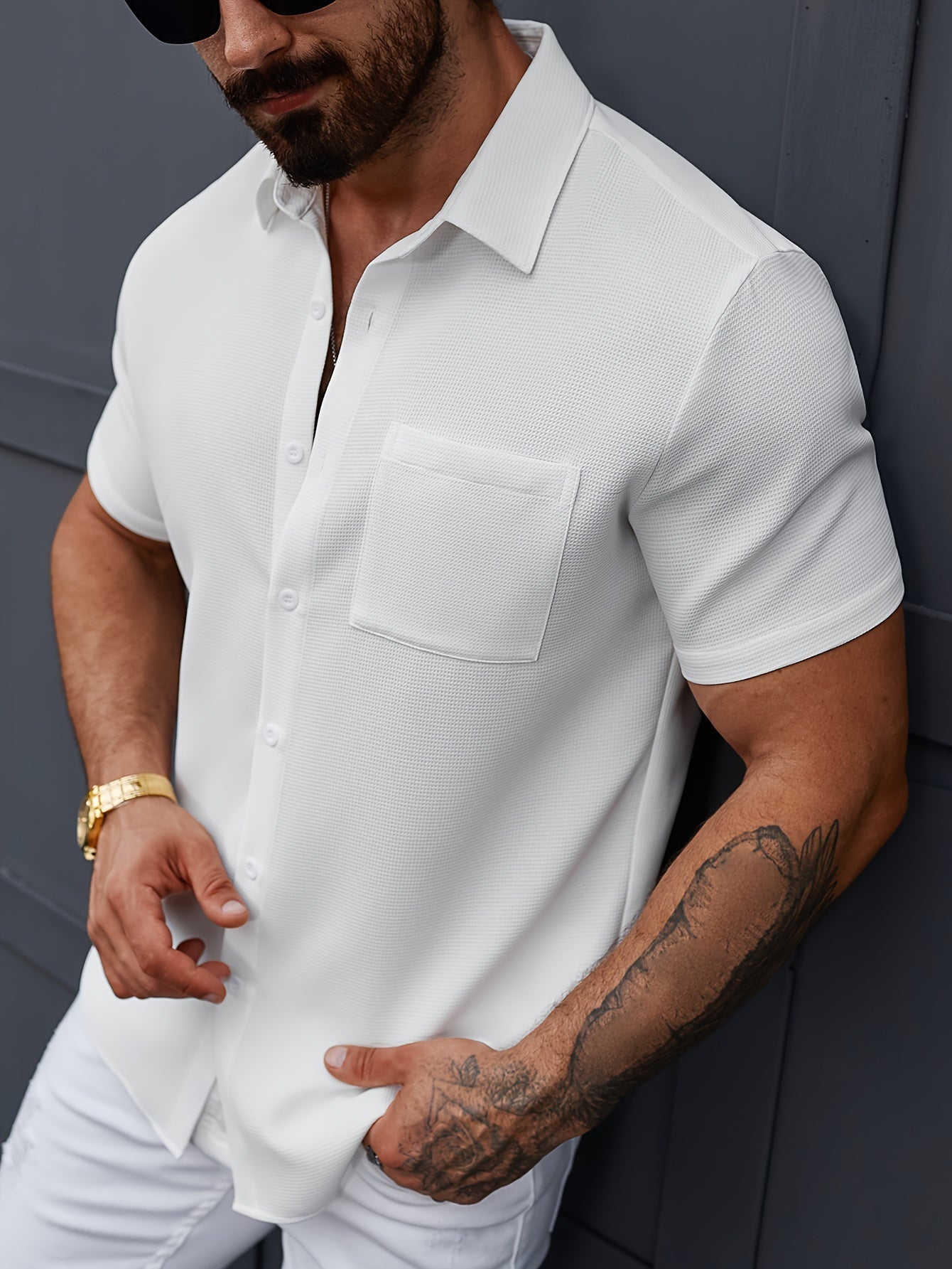 Men's white short sleeve polyester button-up shirt with classic collar, chest pocket, and machine washable. Perfect for summer outings, parties, and casual attire. Great for everyday wear.