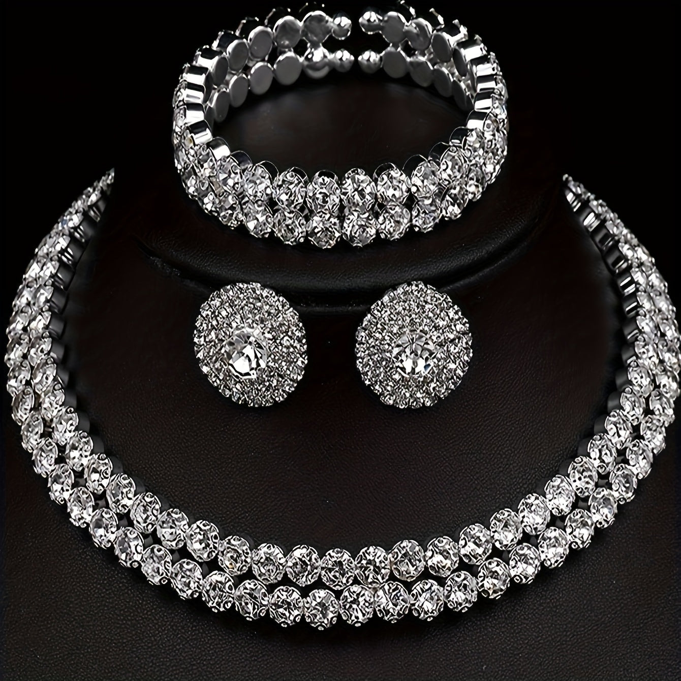 Elegant silver plated jewelry set featuring one pair of earrings, one necklace, and one bracelet all inlaid with shining rhinestones. Perfect for matching with daily outfits or as party accessories.