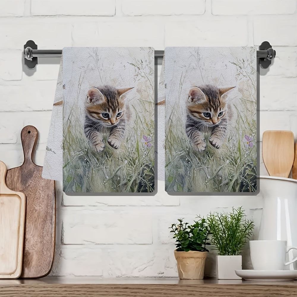 Two ultra soft kitchen towels featuring an adorable kitten in grass design. These towels are highly absorbent, machine washable, and perfect for adding a contemporary coastal touch to your kitchen decor. Each towel measures 40.64x60.96 cm. Perfect for